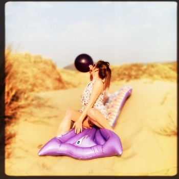 Big purple balloon at the beach-dunes