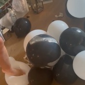 Sam popping balloons barefoot