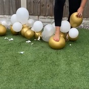 Freinds Mother popping balloon arch