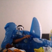 Blowing up blue inflatable whale