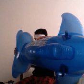 Blowing up blue inflatable whale