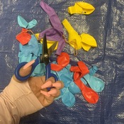 CUT BALLOONS WITH SCISSORS