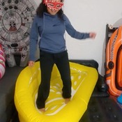 Barefeet walk and jump on yellow sofa and blue whale riding
