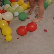 Hot mum bursting balloons