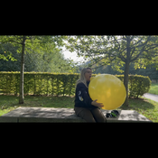 Blow to pop Yellow balloon outdoor