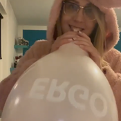 Blow to pop pink balloon