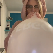 Blow to pop pink balloon