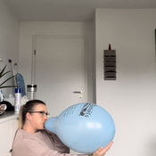 Blow to pop two balloons