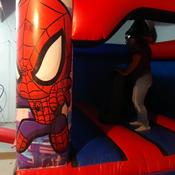 julie jumping on inflatable castle (spiderman)