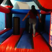 julie jumping on inflatable castle (spiderman)
