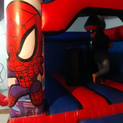 julie jumping on inflatable castle (spiderman)