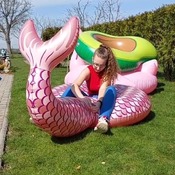 Daniela inflating and deflating mermaid tail float