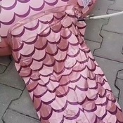 Daniela inflating and deflating mermaid tail float