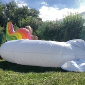 Danny inflating unicorn float to pool