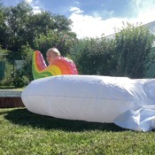 Danny inflating unicorn float to pool