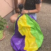 Jenny inflating big beach ball