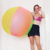 Jenny inflating big beach ball
