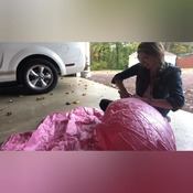 Mermaid inflating flamingo and other float