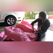 Mermaid inflating flamingo and other float