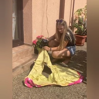 Monica inflating donutheart at the hot day