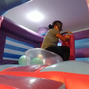 Popping balloons in the big inflatable castle!!