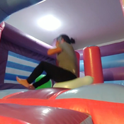 Popping balloons in the big inflatable castle!!