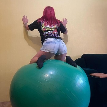 Valeria bouncing and deflating pink ball