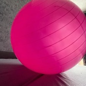 Valeria bouncing and deflating pink ball