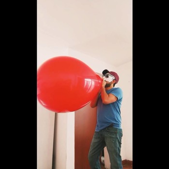 Mouth blow red balloon