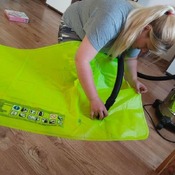 Nina inflating inflatables on the summer 2025