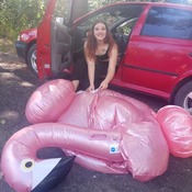 Lera and zuzana inflating and shooting with flamingo