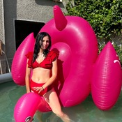 Lera with inflatable flamingo and donut and mattress