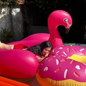 Lera with inflatable flamingo and donut and mattress