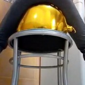 Golden balloons sit to pop