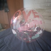 Boy Sit to pop balloon bubble "love"