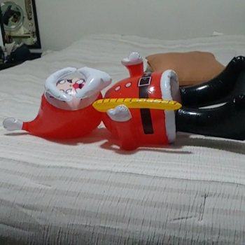 Popping inflatable santa by feets