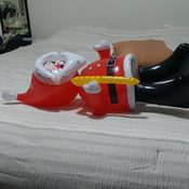Popping inflatable santa by feets