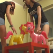 2 sexy girls and 2 ponys inflatables sit to pop