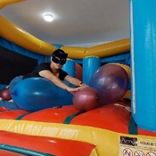 Popping balloons by nail and ride to pop in the inflatable castle!!!