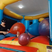 Popping balloons by nail and ride to pop in the inflatable castle!!!