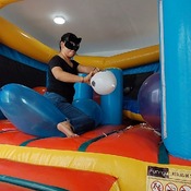Popping balloons by nail and ride to pop in the inflatable castle!!!