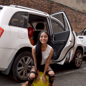 taking out and popping the balloons from the car